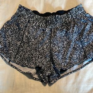 Lululemon Hotty Hot shorts. Size 6, 2.5 inseam. Black and white, and silver.